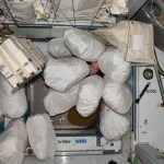 NASA astronaut Don Pettit, Expedition 30 flight engineer, pictured among stowage bags in the Harmony node of the space station.