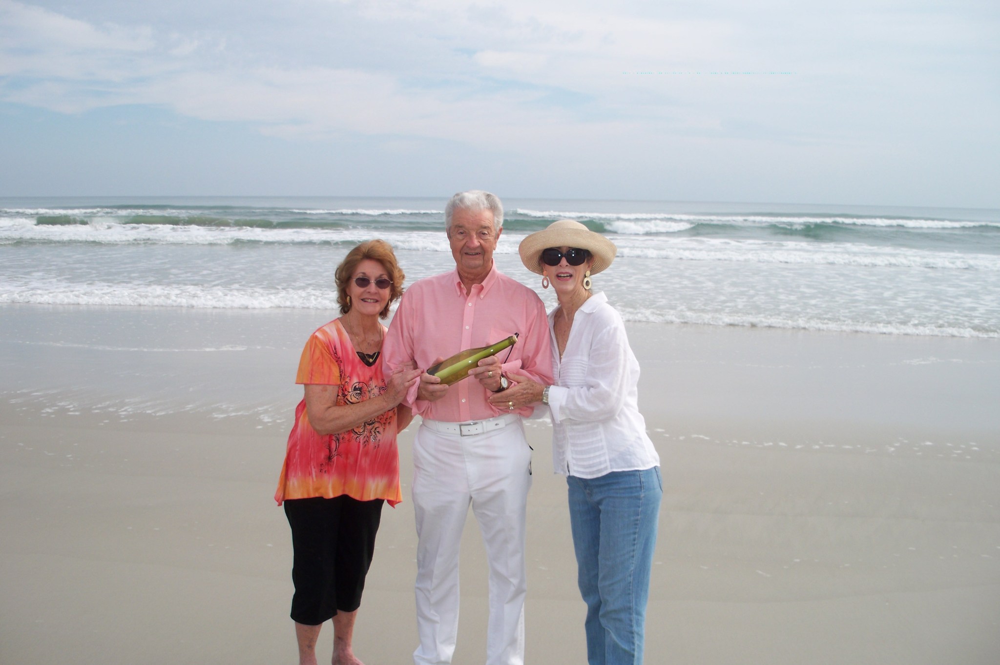 Sisters Annis and Victoria, along with Victoria’s husband Dean, pause for a photo with the bottle before its release.