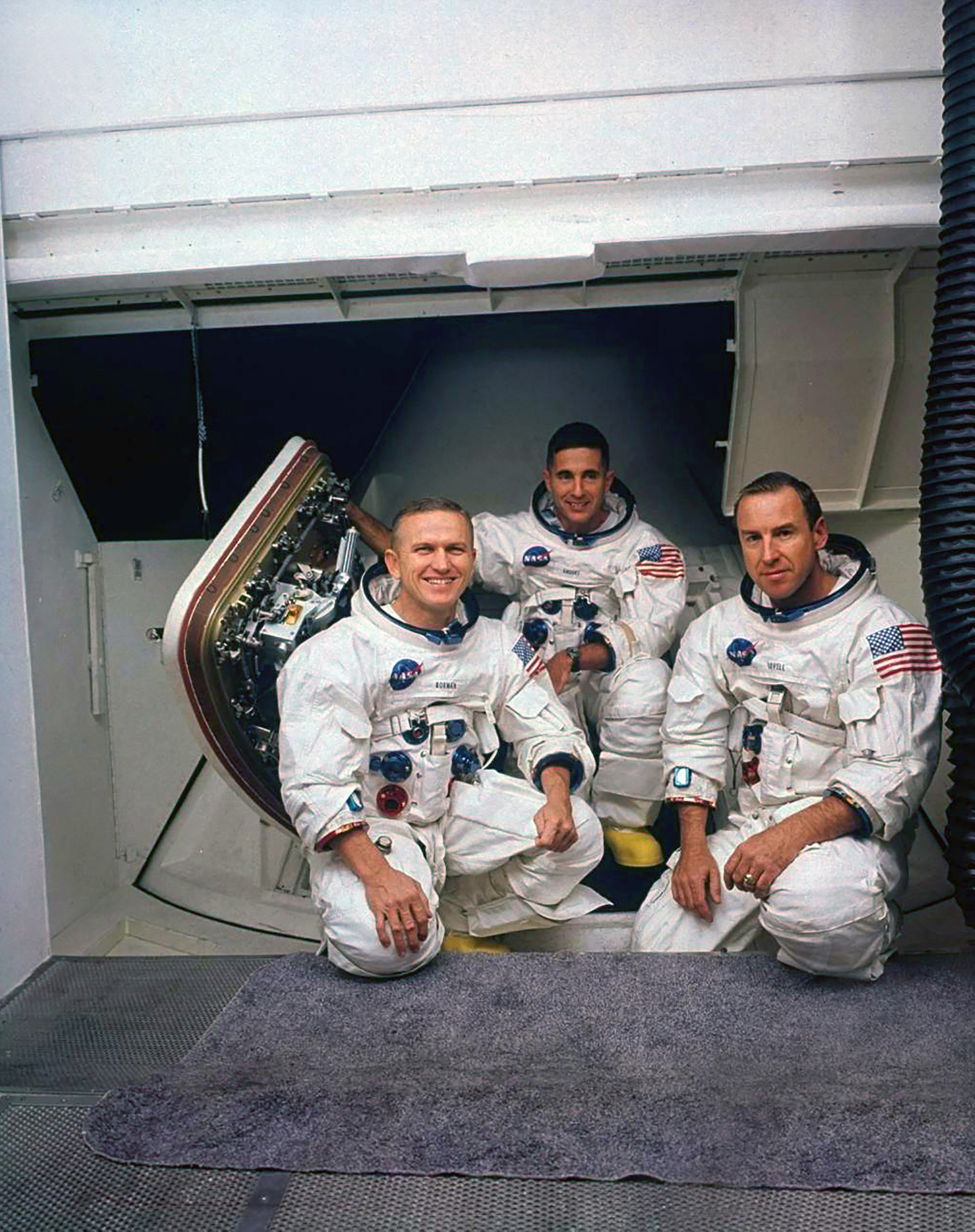 Crewmembers (left to right) Borman, Anders, and Lovell pose outside the simulator