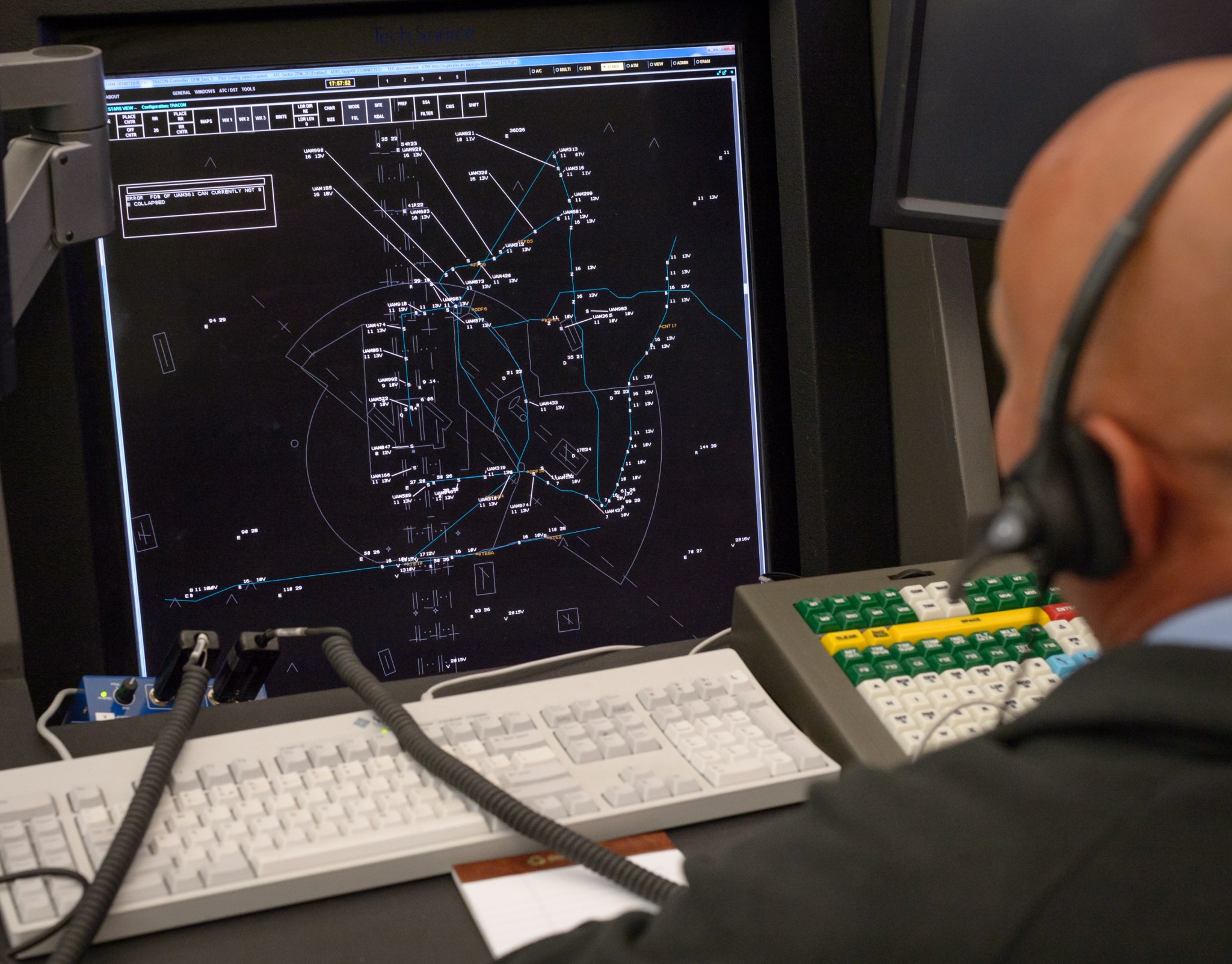 simulation controller station and human controller with headset