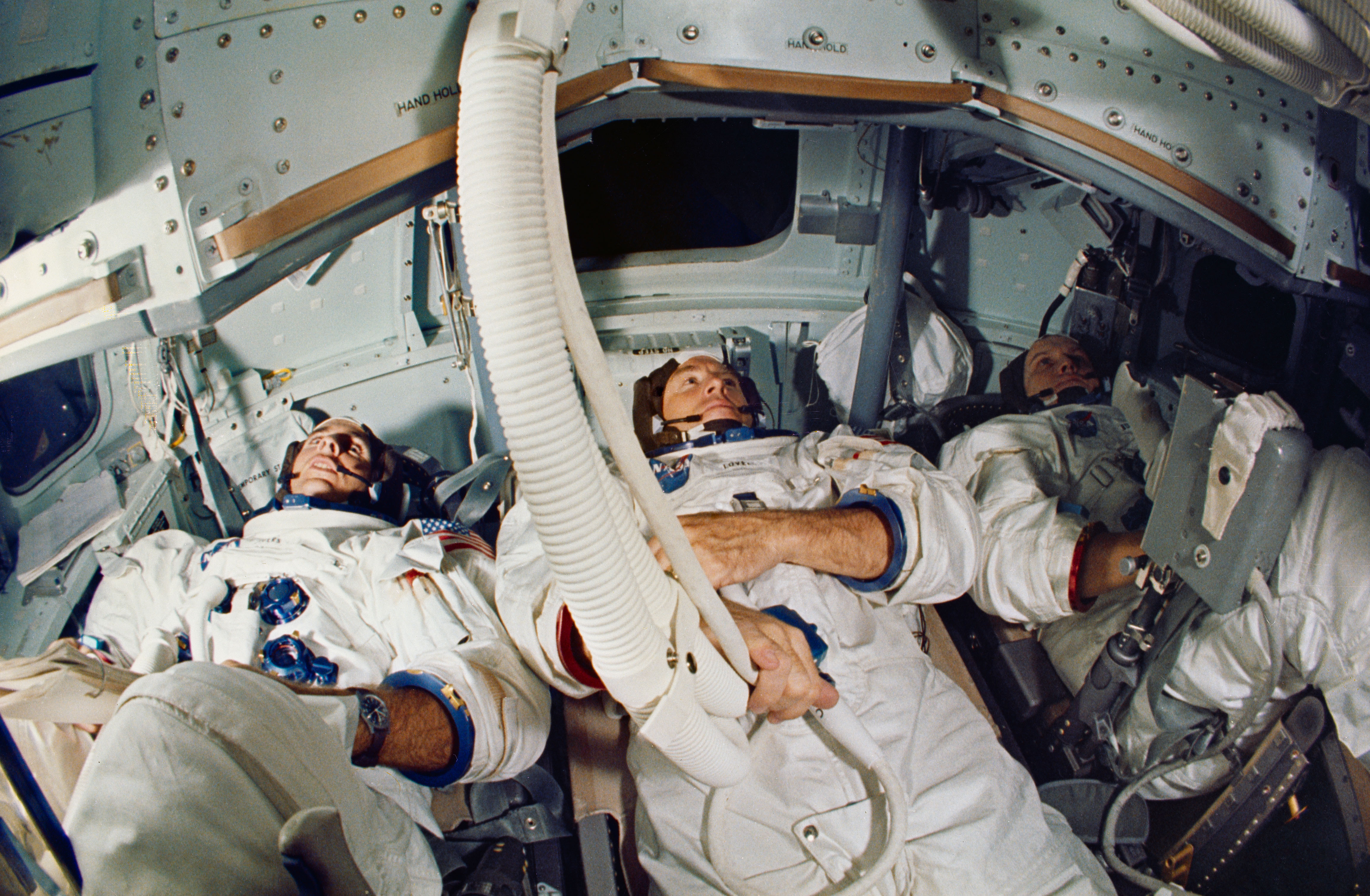 Apollo 8 prime crew of (left to right) Anders, Lovell, and Borman in the CM mission simulator at KSC