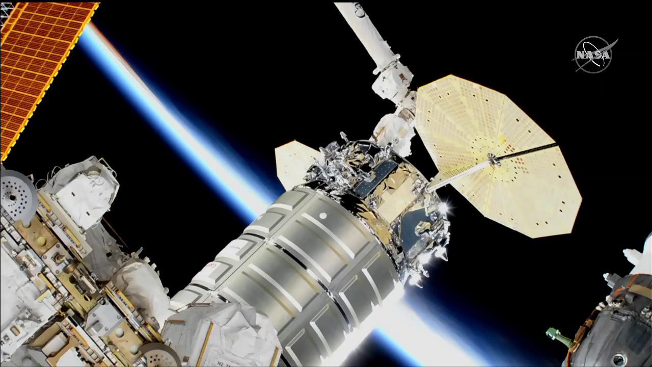 The International Space Station heads into an orbital sunset