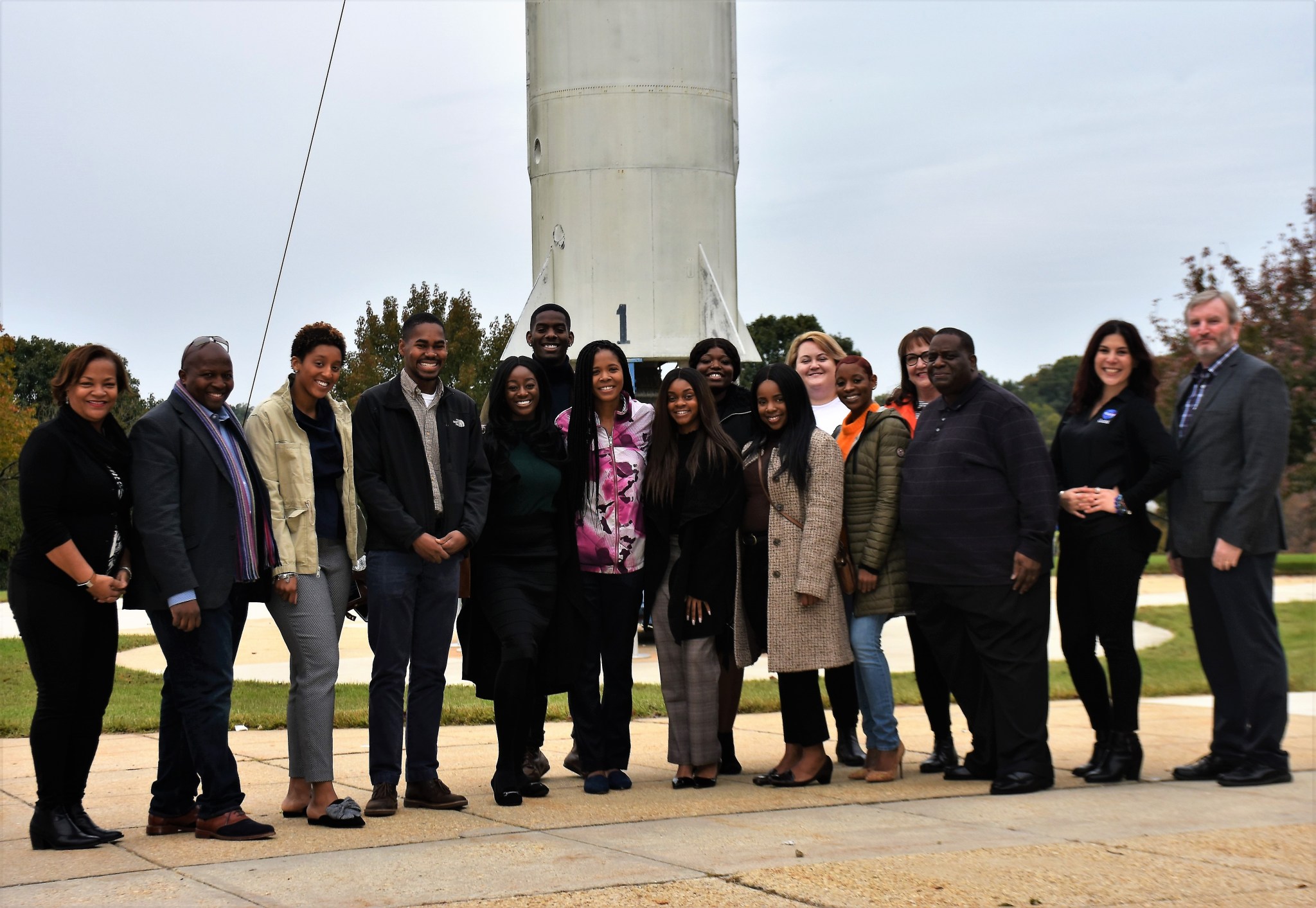 ILI T.I.M.E. Challenge participants pose by Delta rocket at Goddard Visitor Center