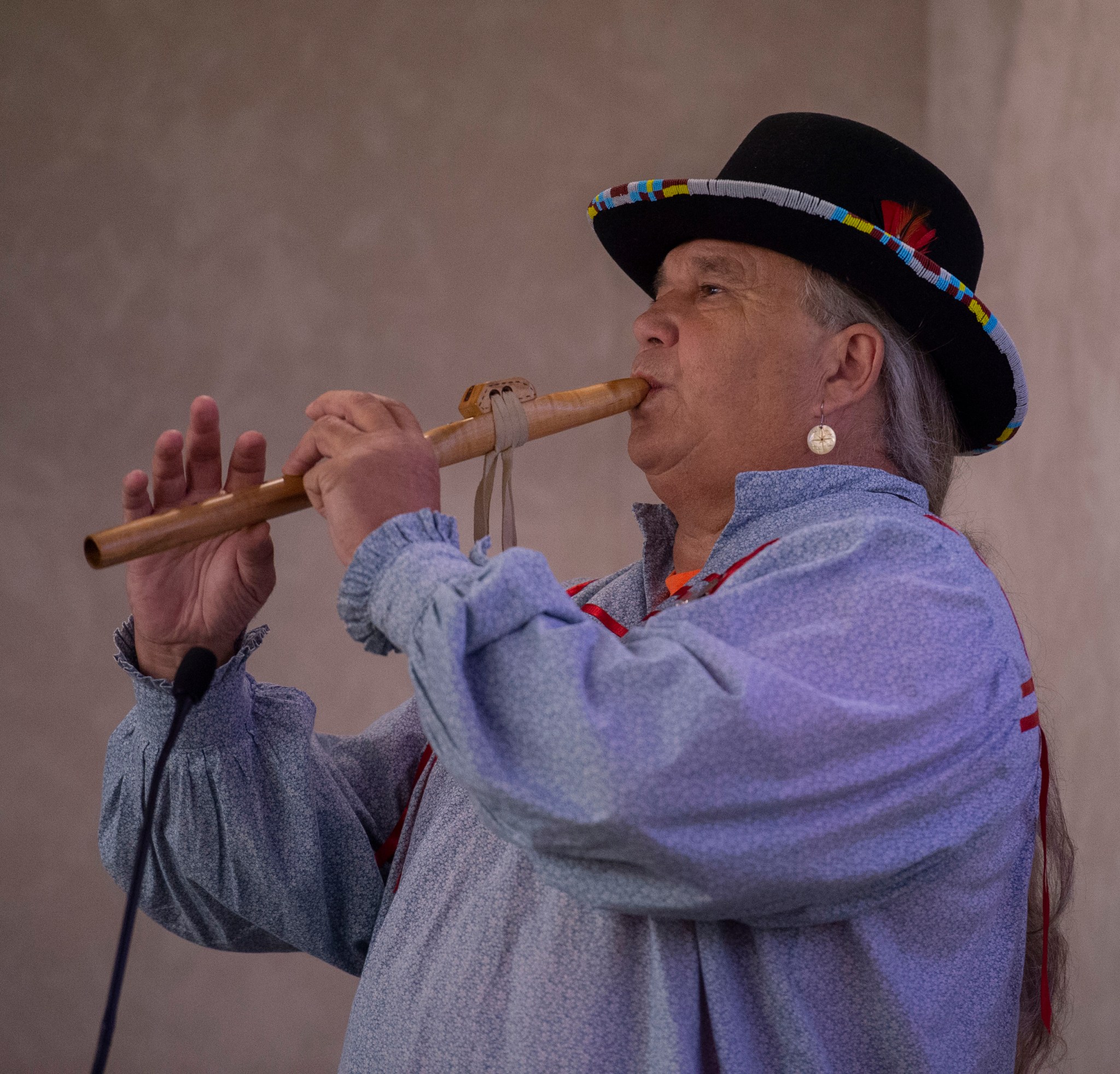 Jimmy Yellowhorse, from Decatur, Alabama, plays a hand-carved flute during the Native American Heritage Month program Nov. 13.