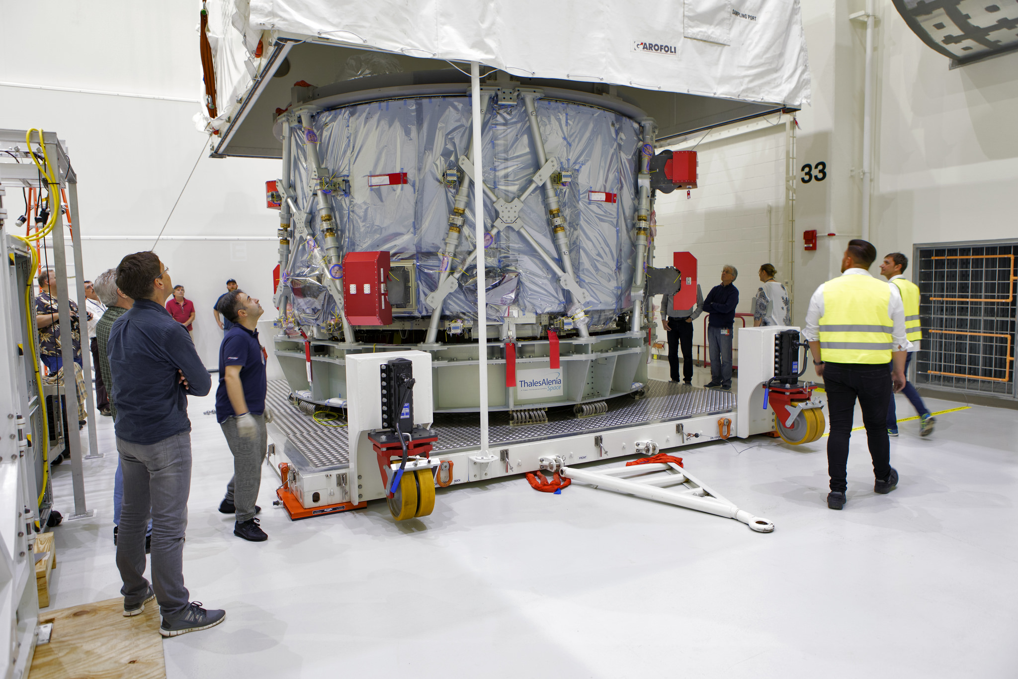 Engineers and technicians from ESA (European Space Agency) and ESA contractor Airbus uncrate Orion's European Service Module