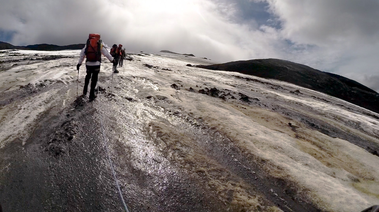 Researchers climbing a glacier.