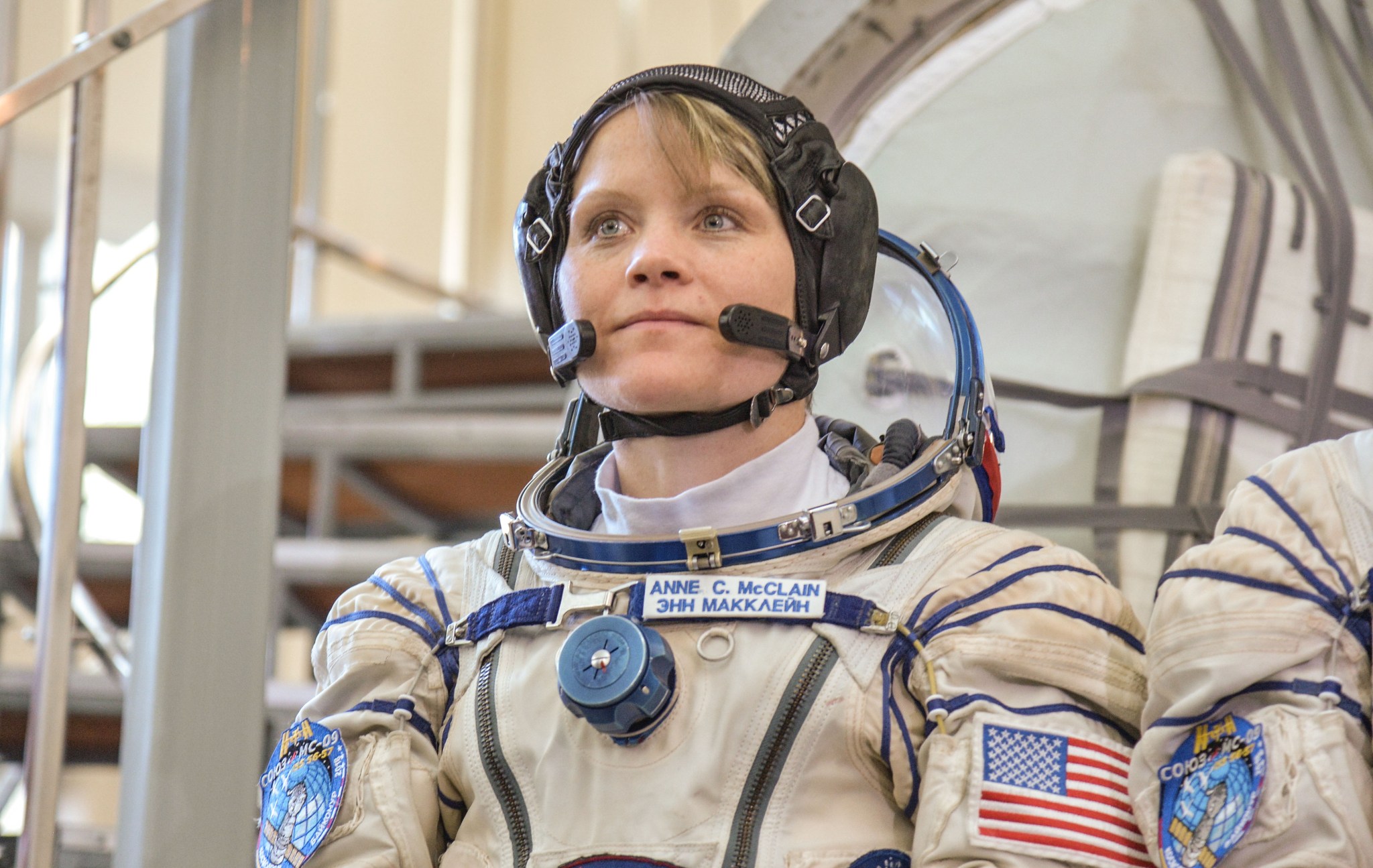 NASA astronaut Anne McClain listens to a reporter’s question at the Gagarin Cosmonaut Training Center in Star City, Russia.