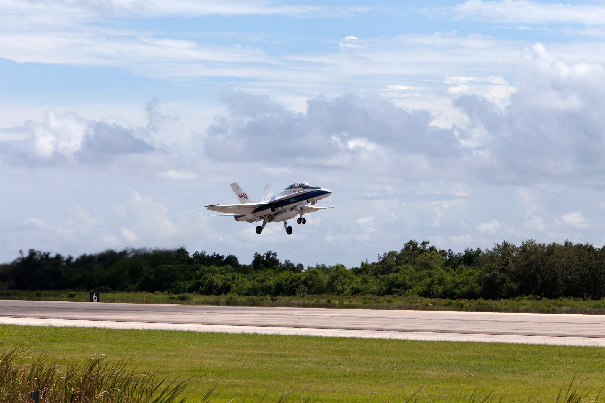 NASA Armstrong’s F/A-18 aircraft coming in for a landing on the runway.