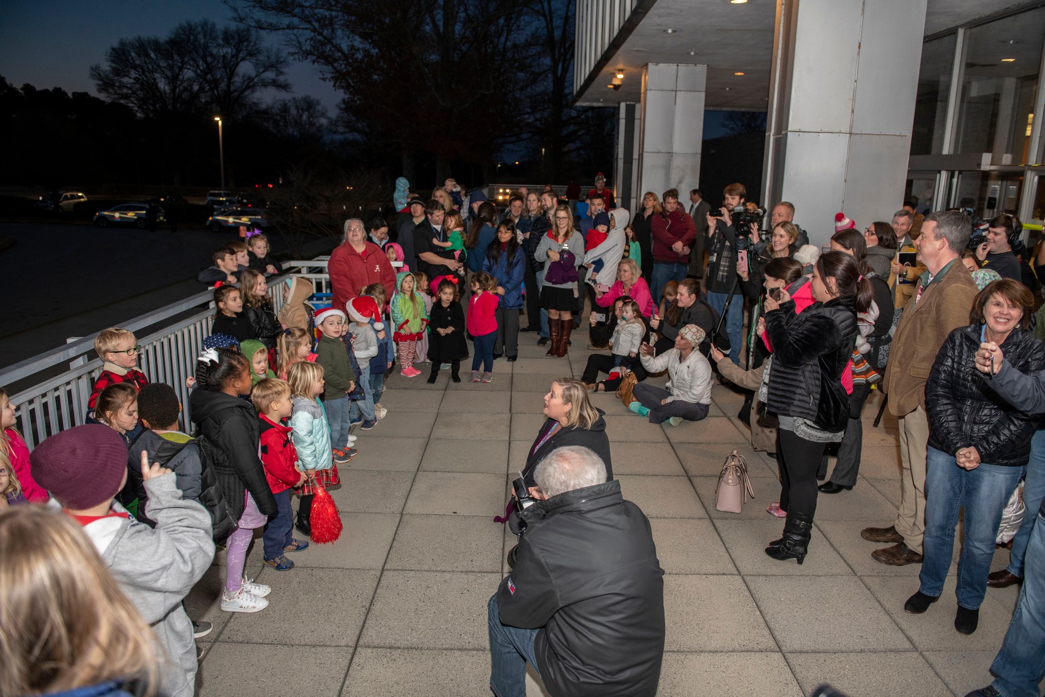 Marshall team members gather to hear songs at the annual Marshall tree-lighting celebration Dec. 3 outside of Building 4200. 