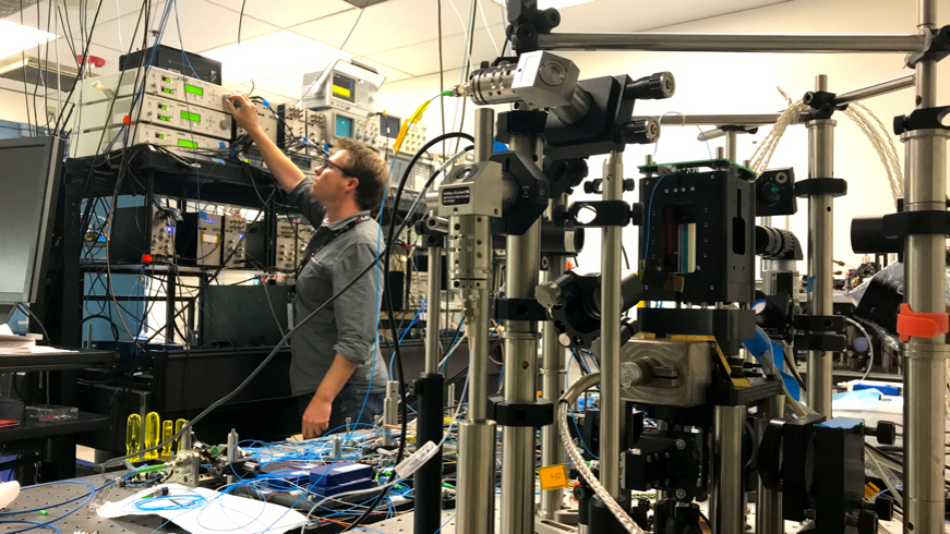 Cold Atom Laboratory (CAL) physicist David Aveline works in the CAL test bed