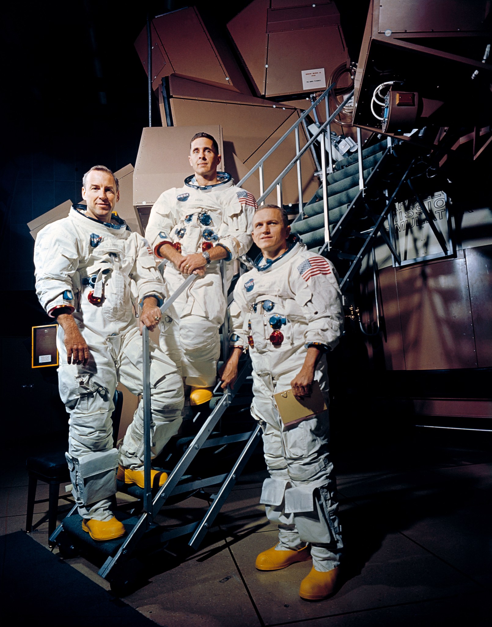 three men in spacesuits