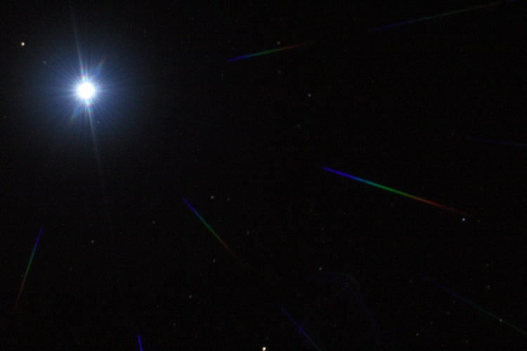Sirius imaged with a telescope equipped with a diffractive pupil which creates the rainbows that are replicas of the star on dif