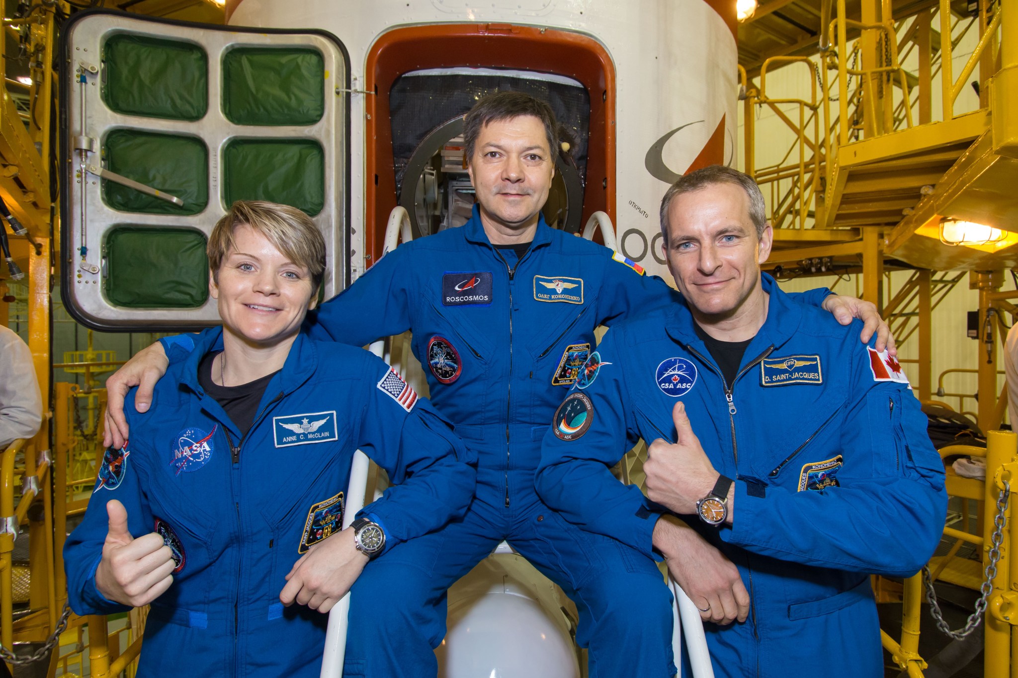 Expedition 58 crew members in front of the Soyuz MS-11 spacecraft