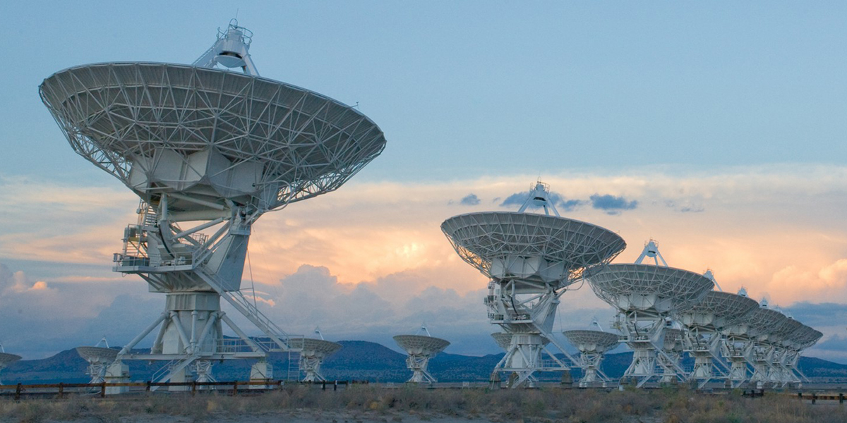 line of satellite dishes shrink into distance