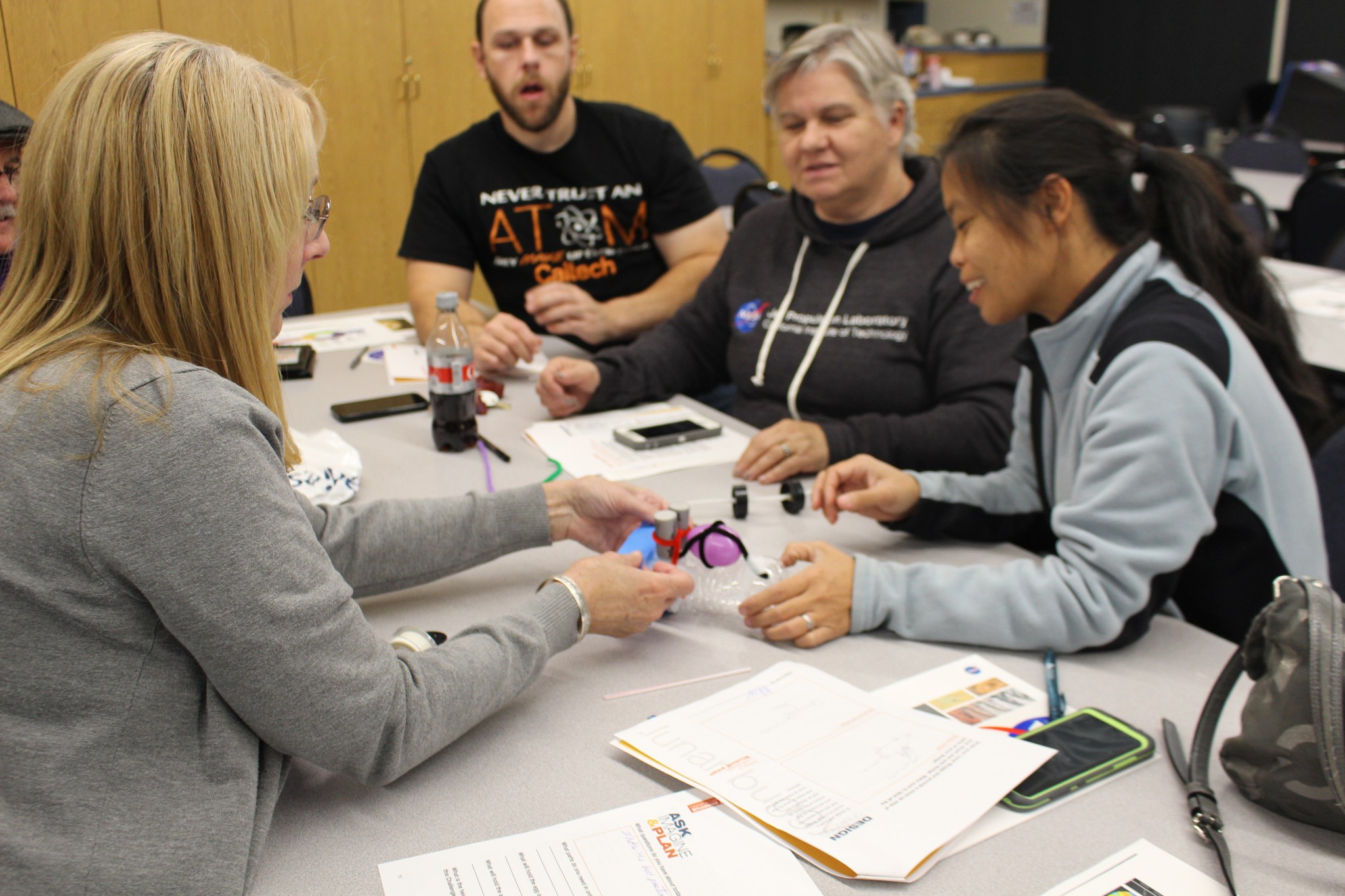 A group of educators participated in a workshop to learn how to use the Engineering Design Process to create, build and test a l
