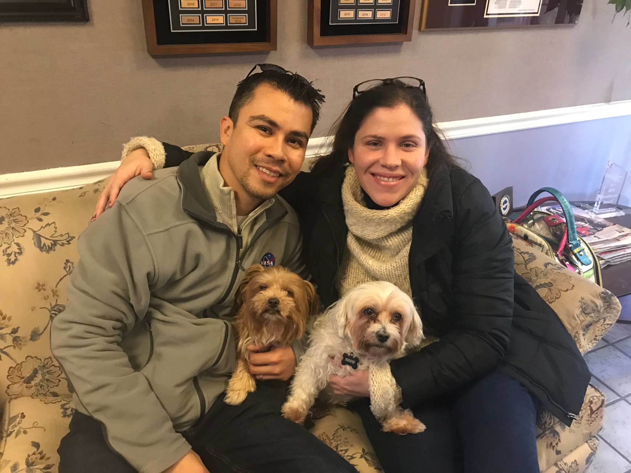 Morales with his wife and his two rescue dogs, Fifi and Snow.