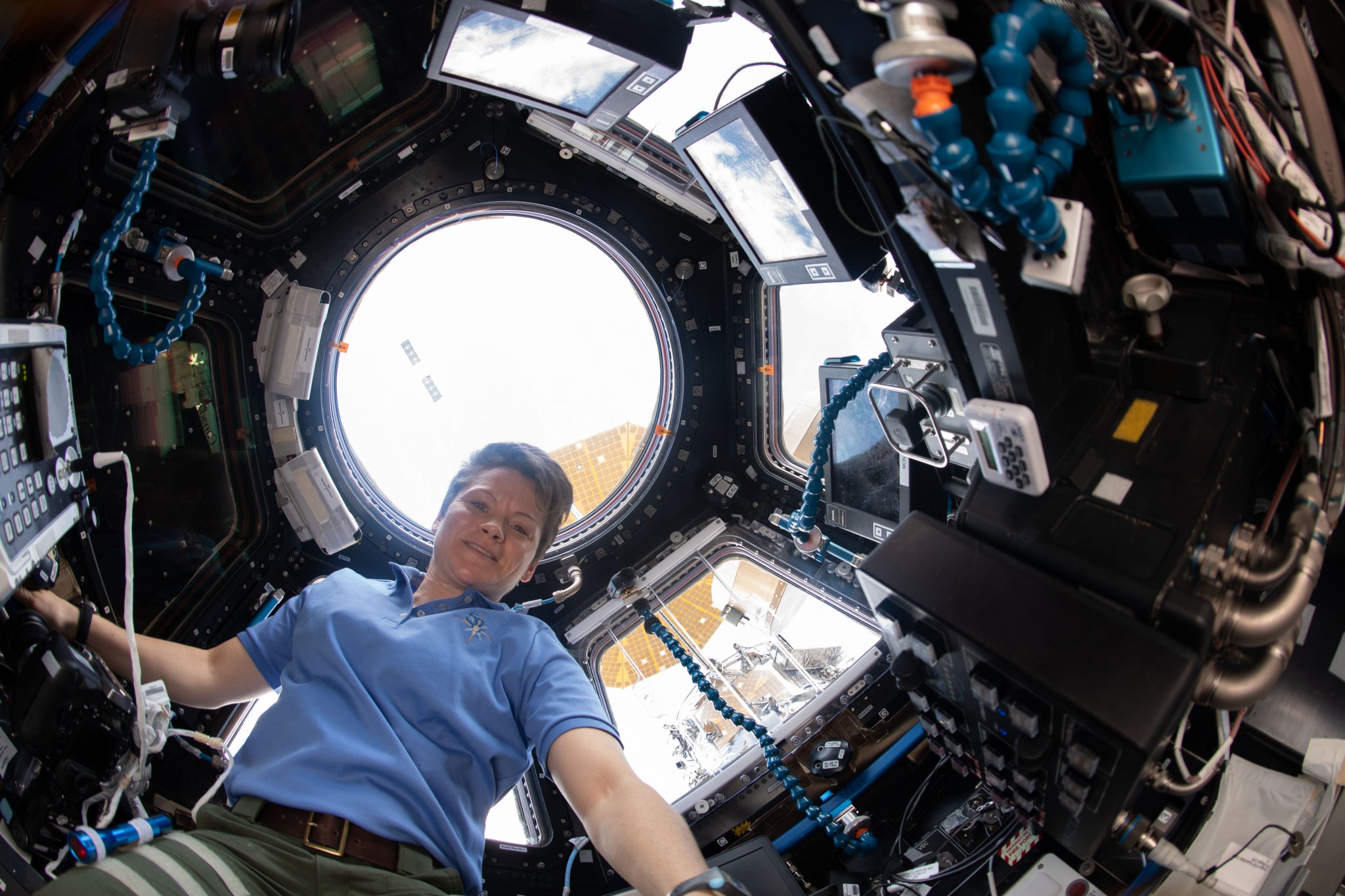 Expedition 58 Flight Engineer Anne McClain in Cupola module during SpaceX Dragon departure