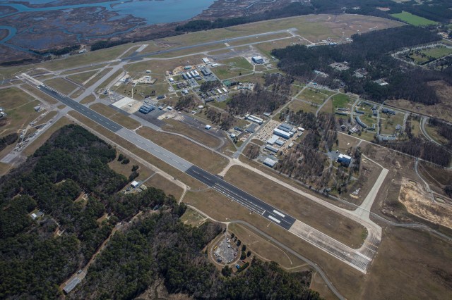 Aerial image of NASA's Wallops Flight Facility main base, with two long air strips with buildings surrounding it.