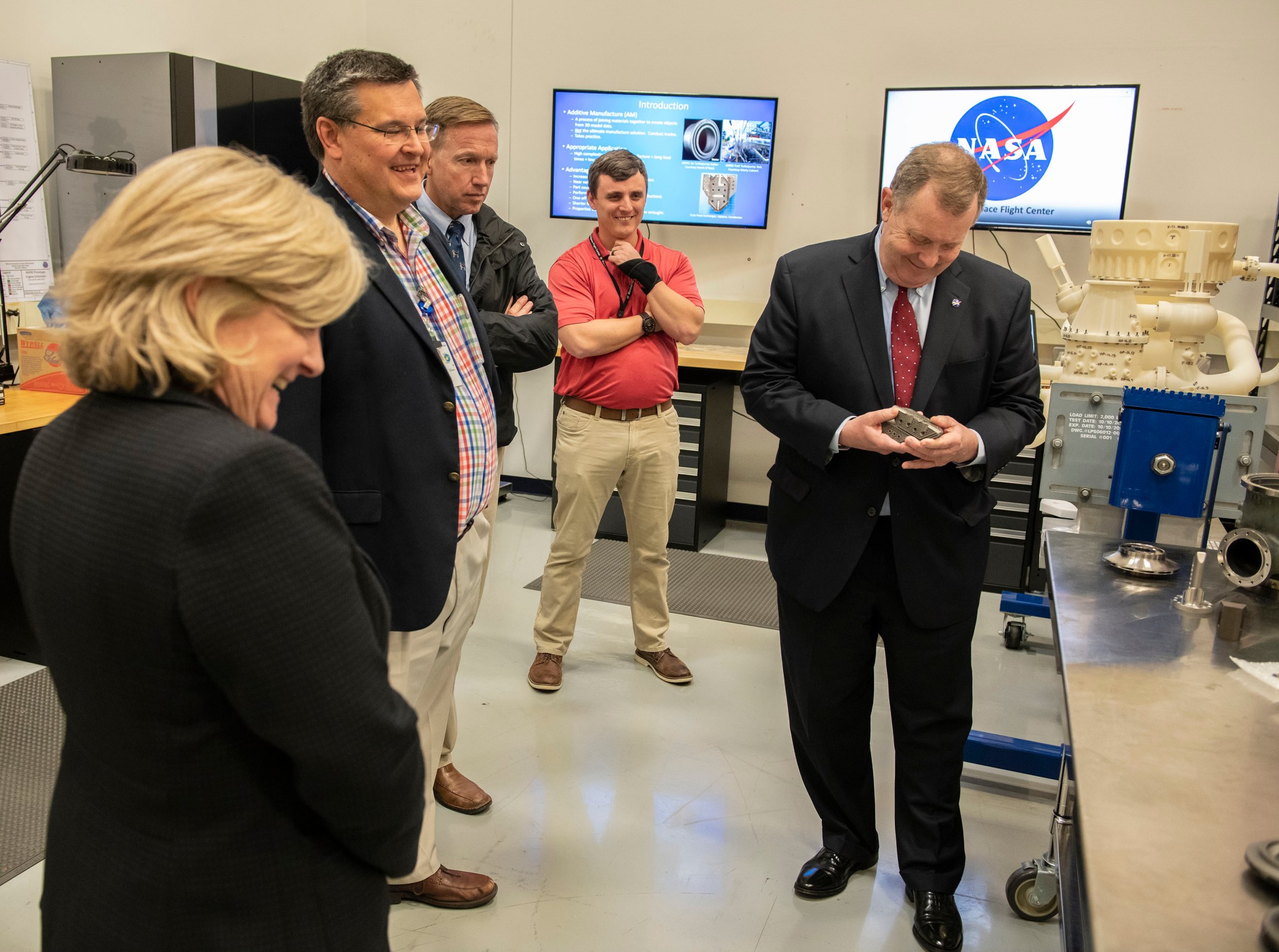 James Morhard, right, tours Marshall's Additive Manufacturing Facility with, left, Jody Singer.