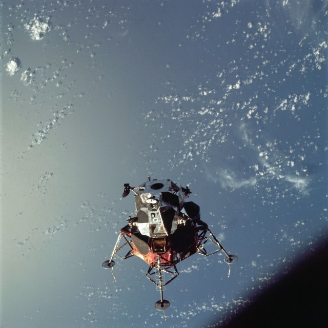 A view of the Apollo 9 lunar module, nicknamed Spider, in a lunar landing configuration above Earth.