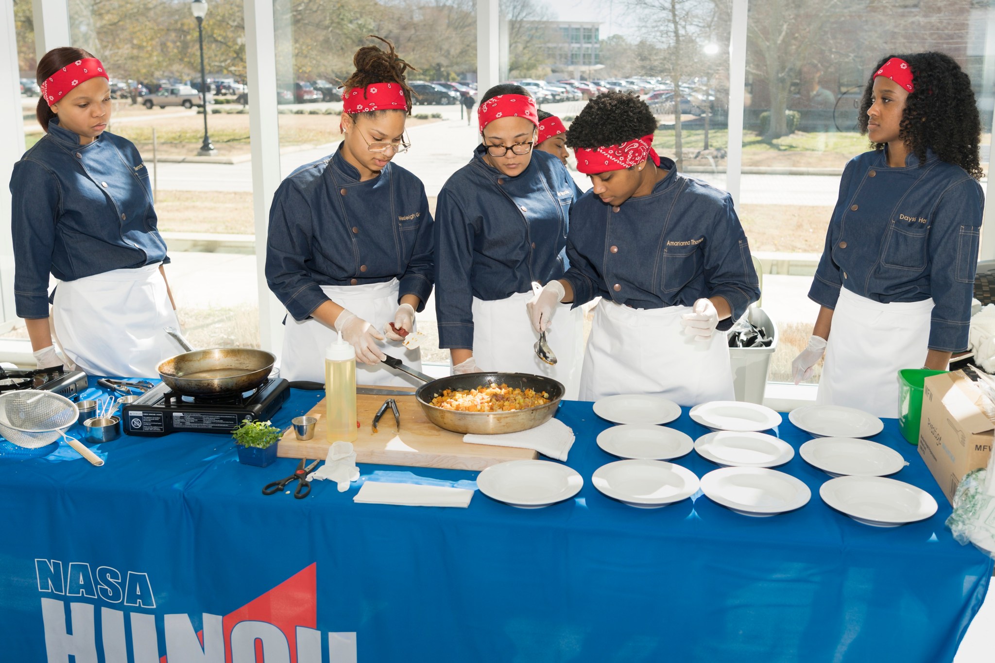 A team of students from Phoebus High School in Hampton, Virginia, take part in NASA Langley's HUNCH Culinary Challenge Feb. 25.