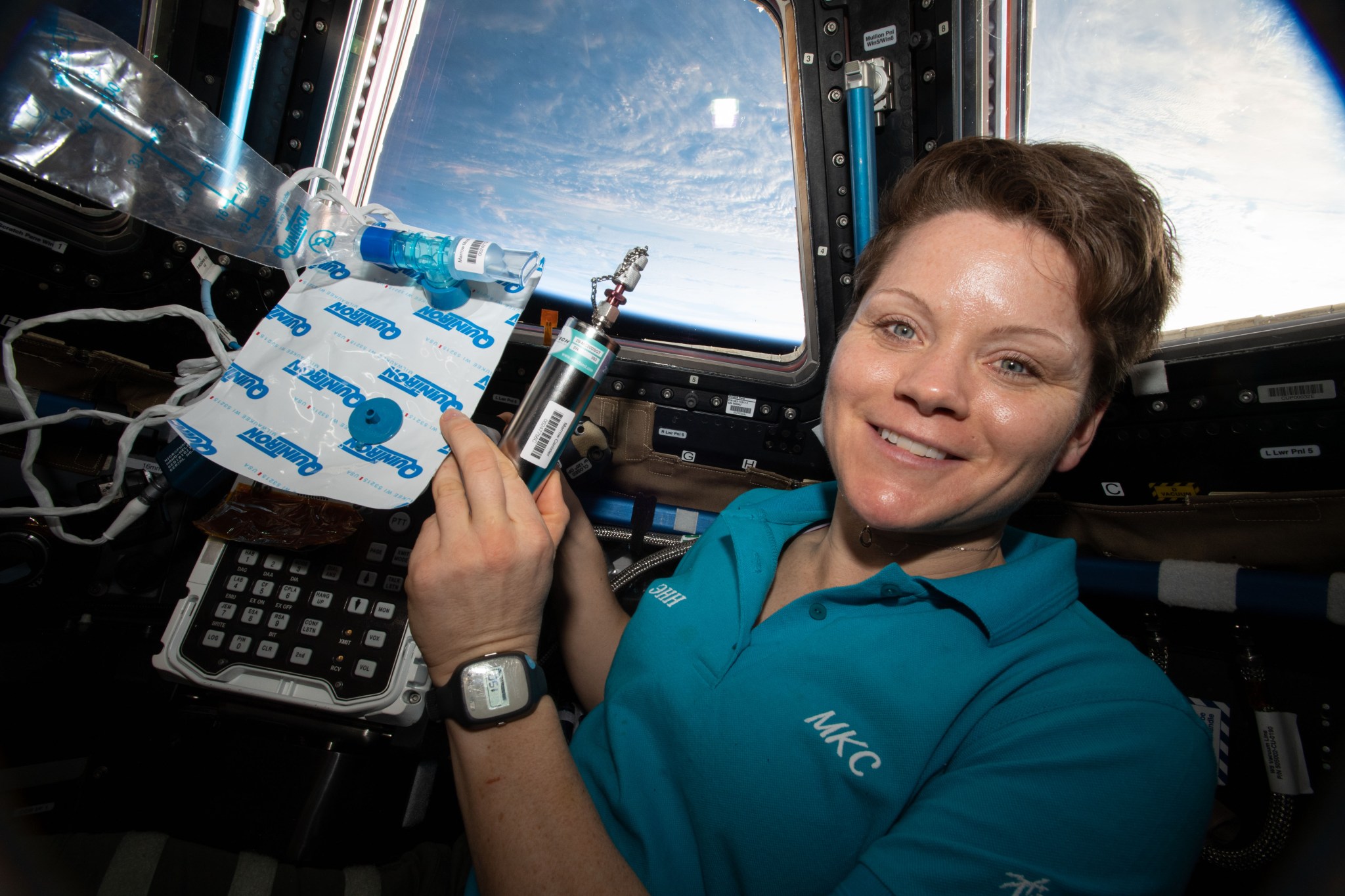 Expedition 58 Flight Engineer Anne McClain of NASA with samples collected for the Canadian Space Agency’s MARROW investigation.
