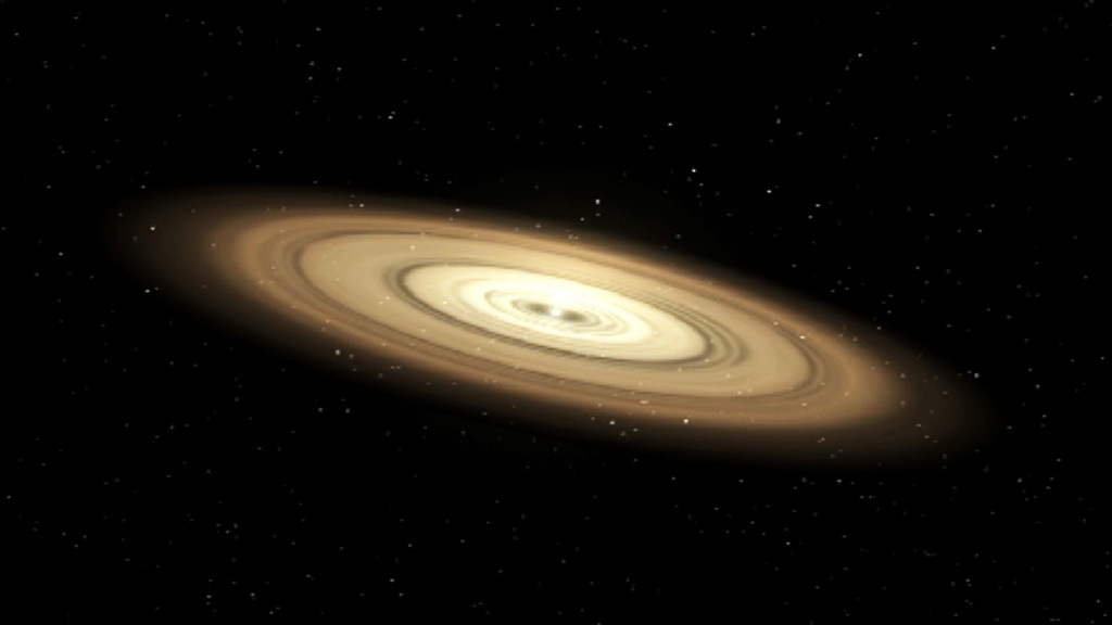 Illustration of a protoplanetary disk of dust and debris surrounding a young star. Concentric rings of bright yellows and golds circle around a bright glowing dot of a star in the center.