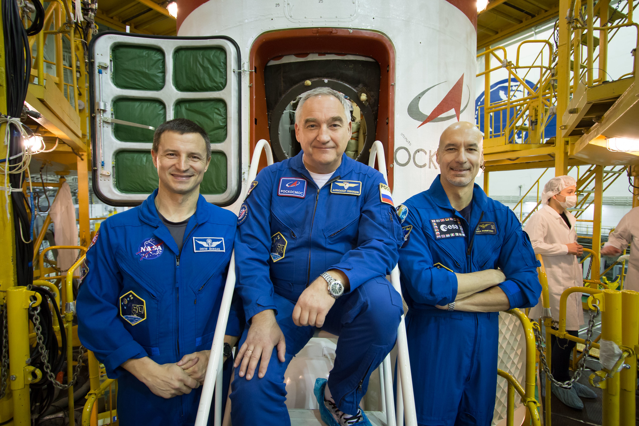 Drew Morgan of NASA (left), Alexander Skvortsov of Roscosmos (center) and Luca Parmitano of the European Space Agency (right)