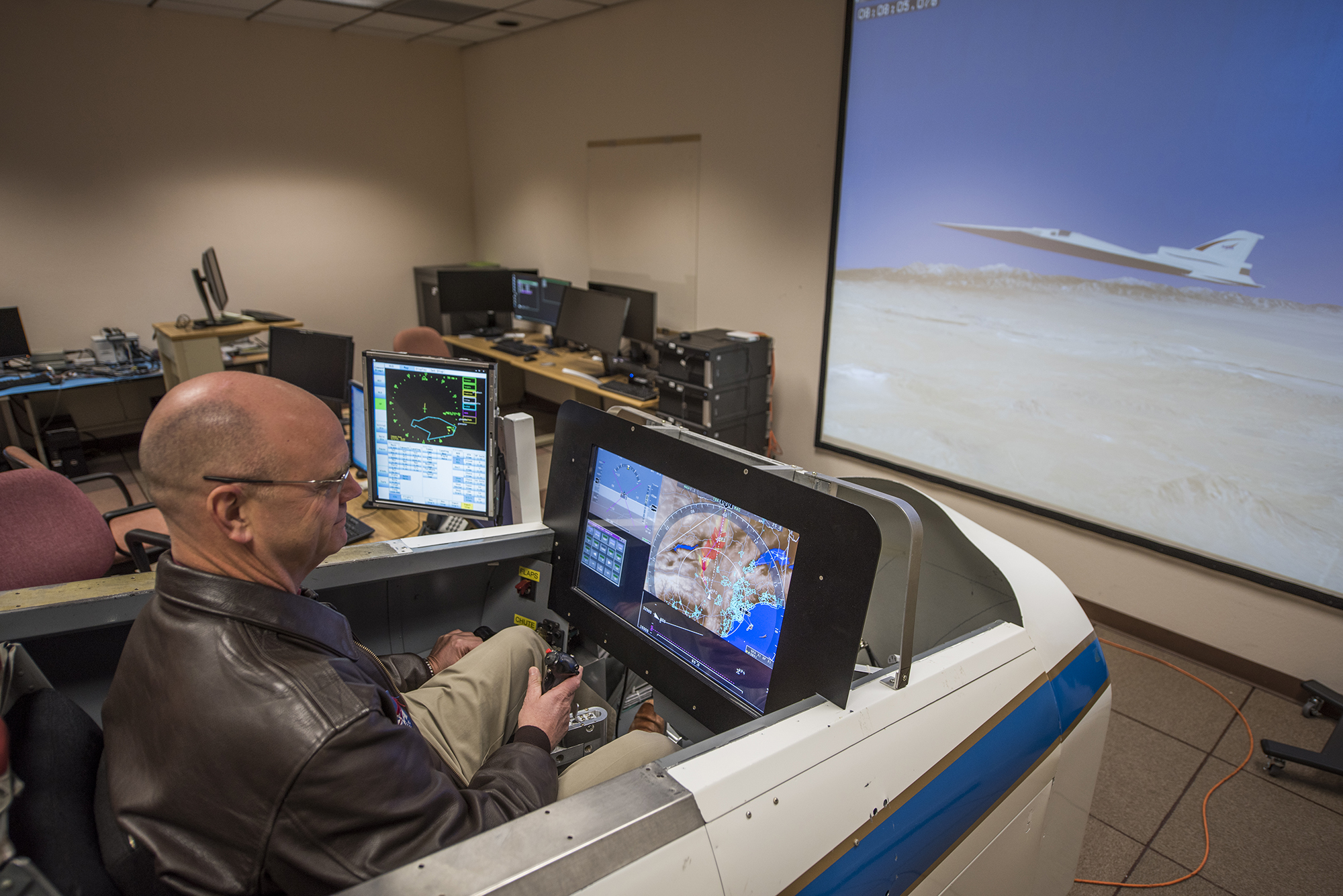 NASA pilot Nils Larson evaluates software in the X-59 simulator.
