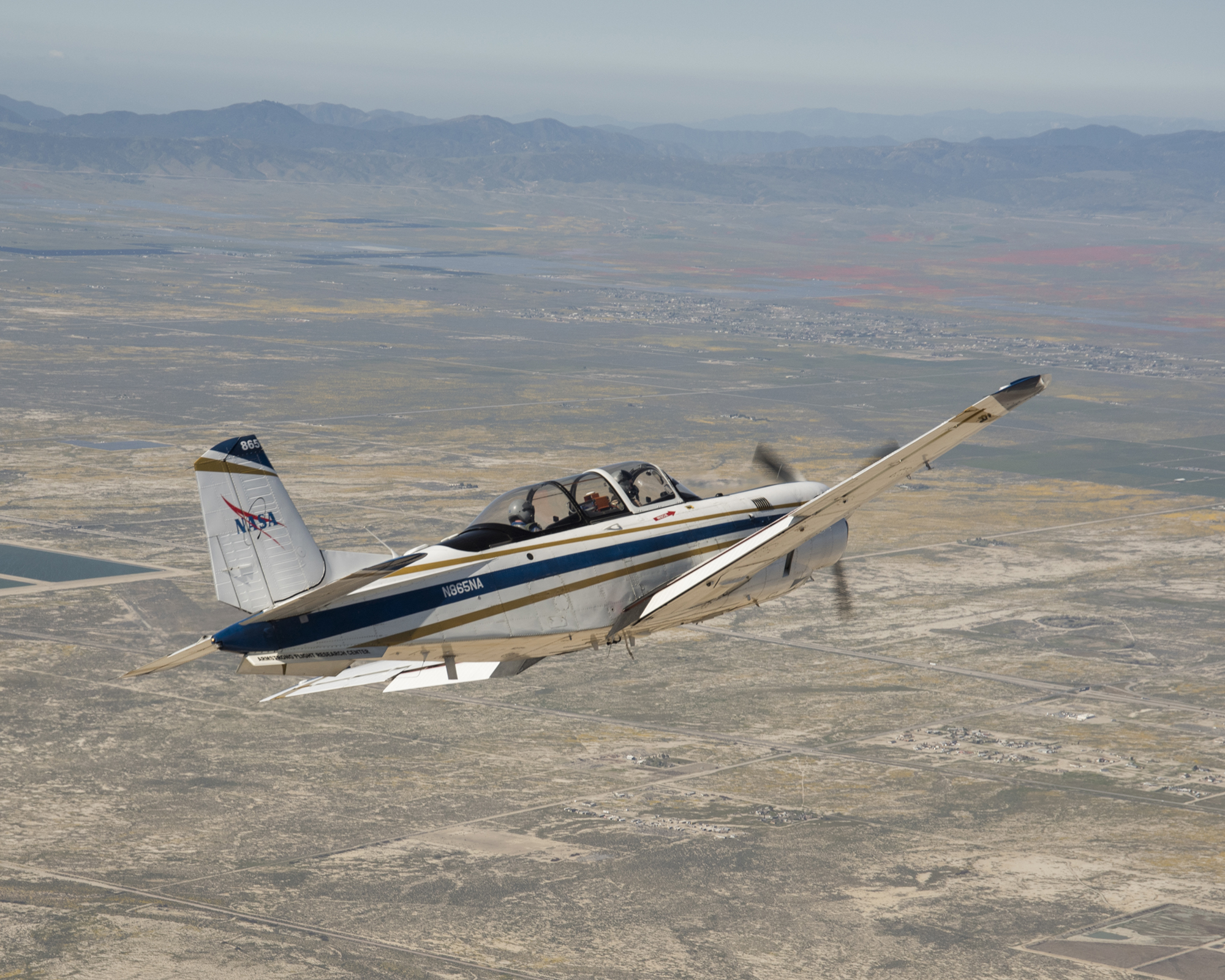 NASA's T-34 aircraft heads toward the Antelope Valley Poppy Reserve in So. Cal.