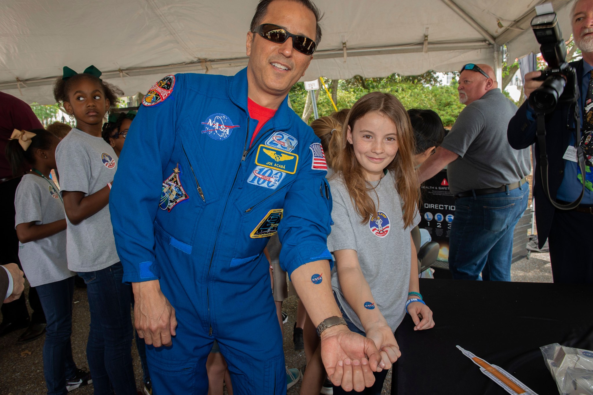 NASA astronaut Joe Acaba, left, and a student from Montgomery’s Bear Exploration Center for Mathematics, Science and Technology.