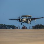 An E-2 navy aircraft prepares to perform a touch and go maneuver on the Wallops runway.