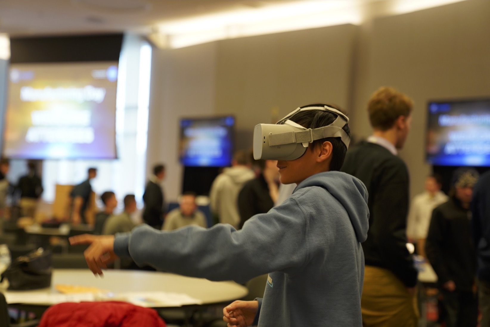 A visitor is immersed in space through a virtual reality tour and learns about space communications.