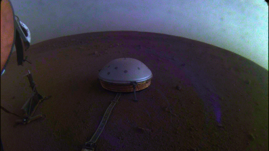 NASA's InSight used its Instrument Context Camera (ICC) beneath the lander's deck to image these drifting clouds at sunset.