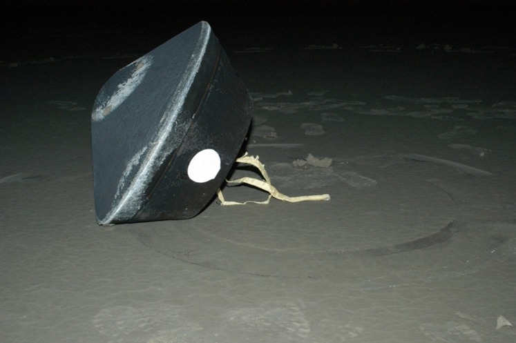 This is a picture of the Stardust Sample Return Capsule as we found it after its return to Earth at the Utah Test and Training R