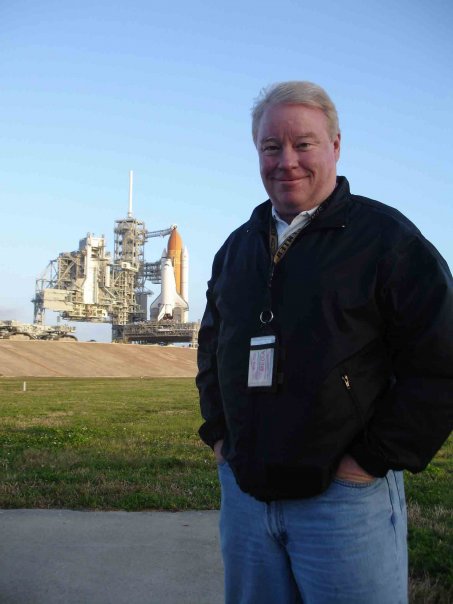 Todd Halvorson, a former journalist with Florida Today/USA Today, photographed in front of one of the space shuttles at Kennedy.