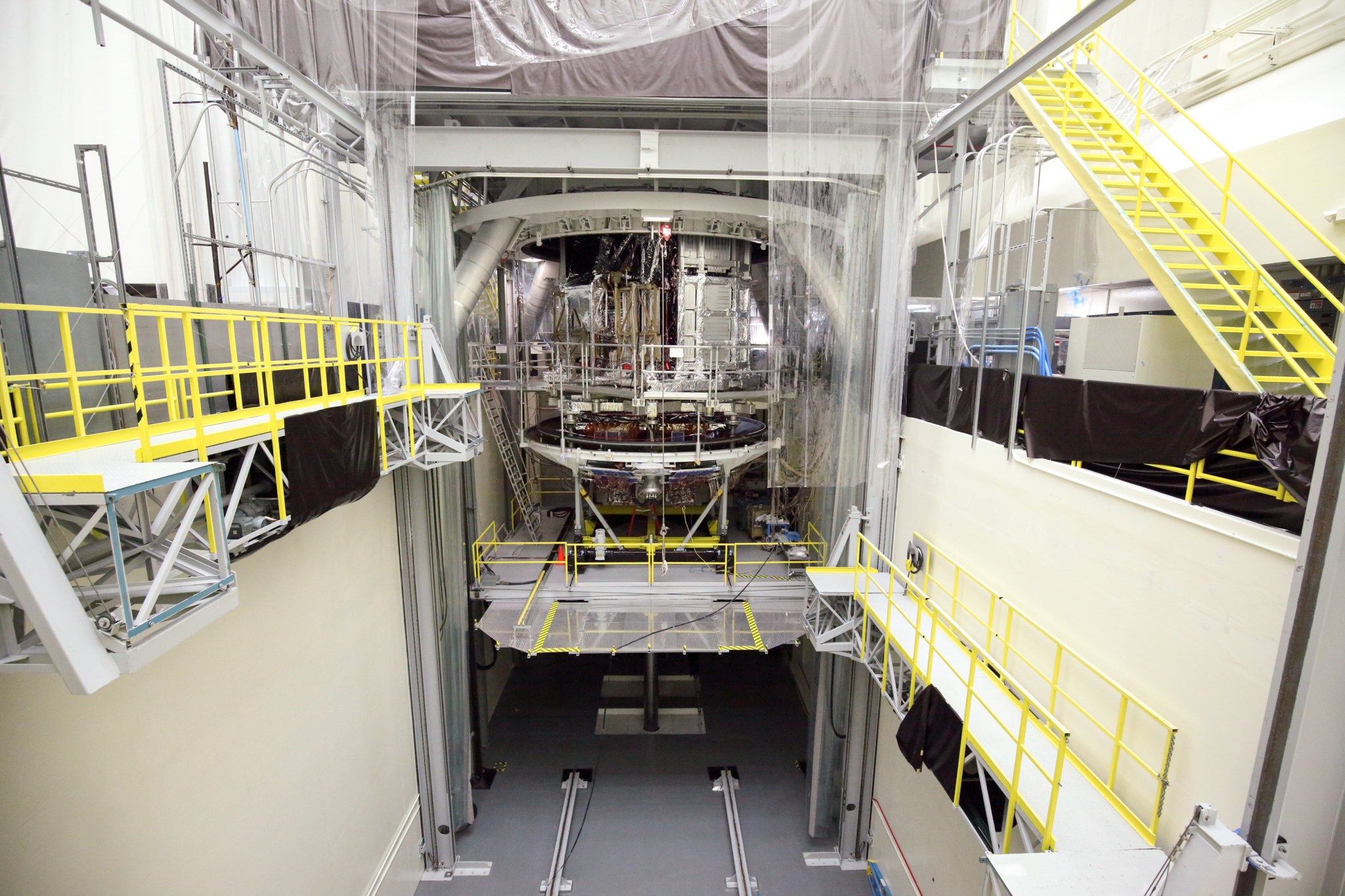 Webb’s spacecraft being lifted into Northrop Grumman’s thermal vacuum chamber for environmental testing.