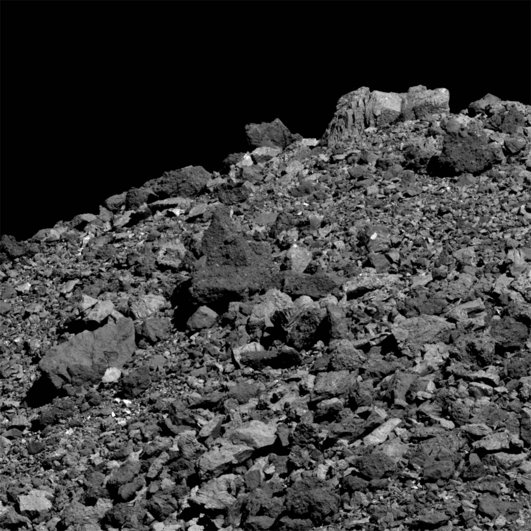 Image of boulders and the edge of asteroid Bennu