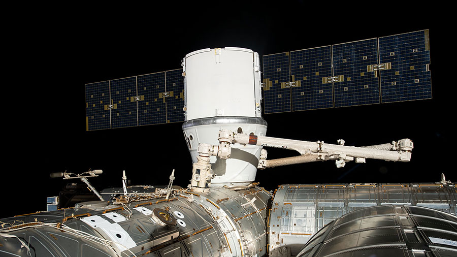 The SpaceX Dragon cargo craft is installed to the Harmony module