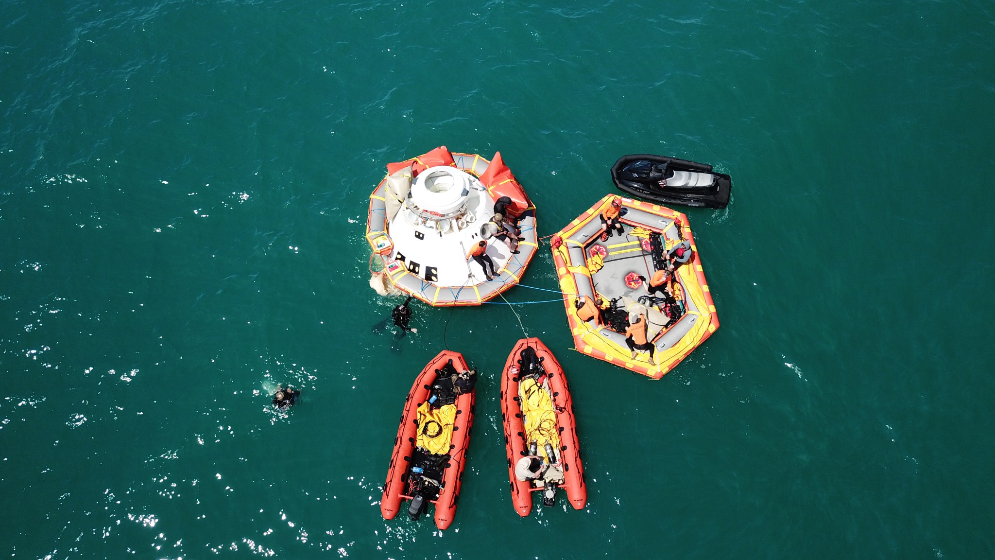 Rescue team members are using a Boeing CST-100 Starliner training capsule to rehearse a search and rescue training exercise.