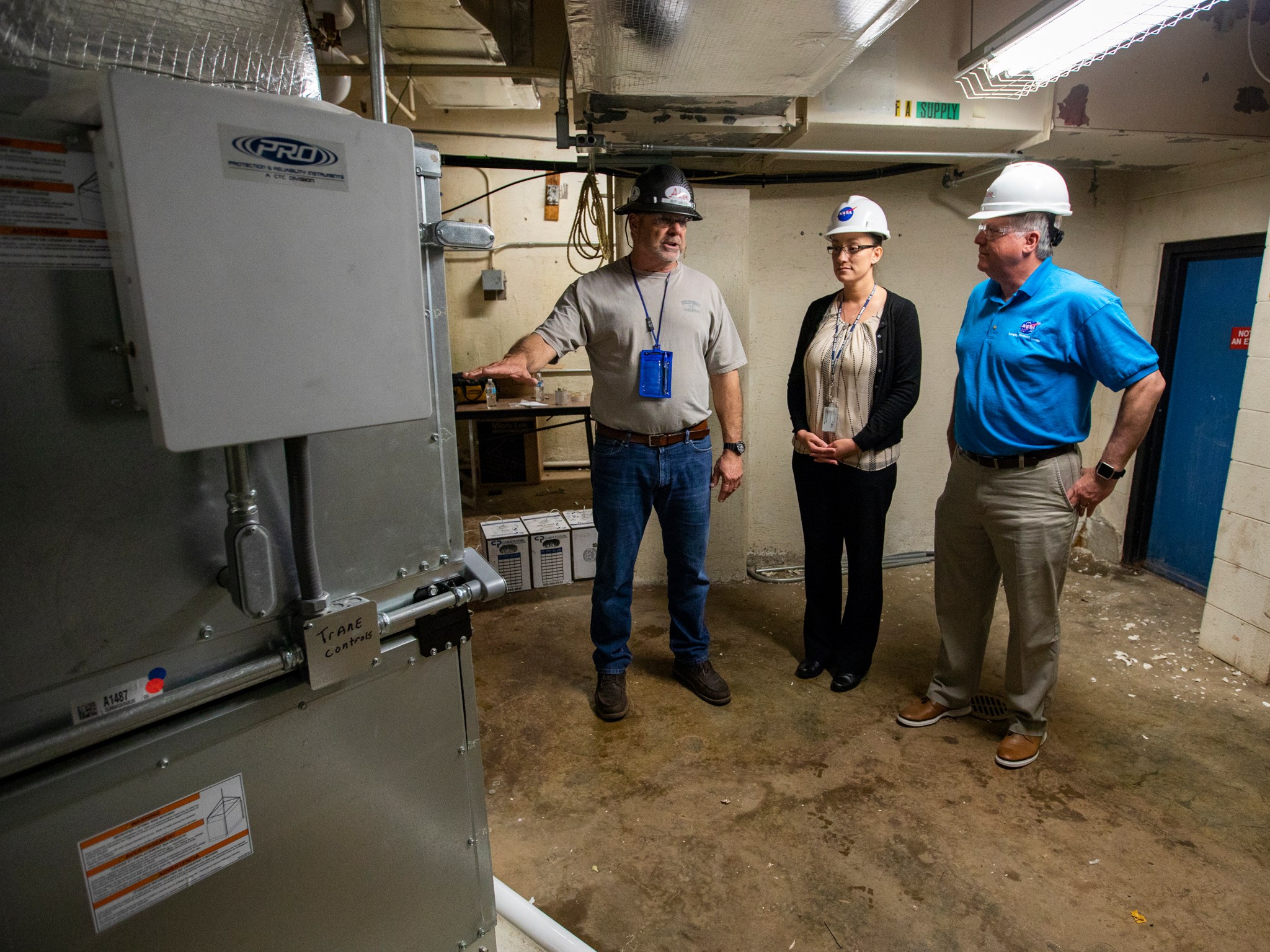 Jeff Gibson, left, Alicia Kelly-Eslinger, center, and Robert Betts look over a section of Langley's Acoustics Research Facility.