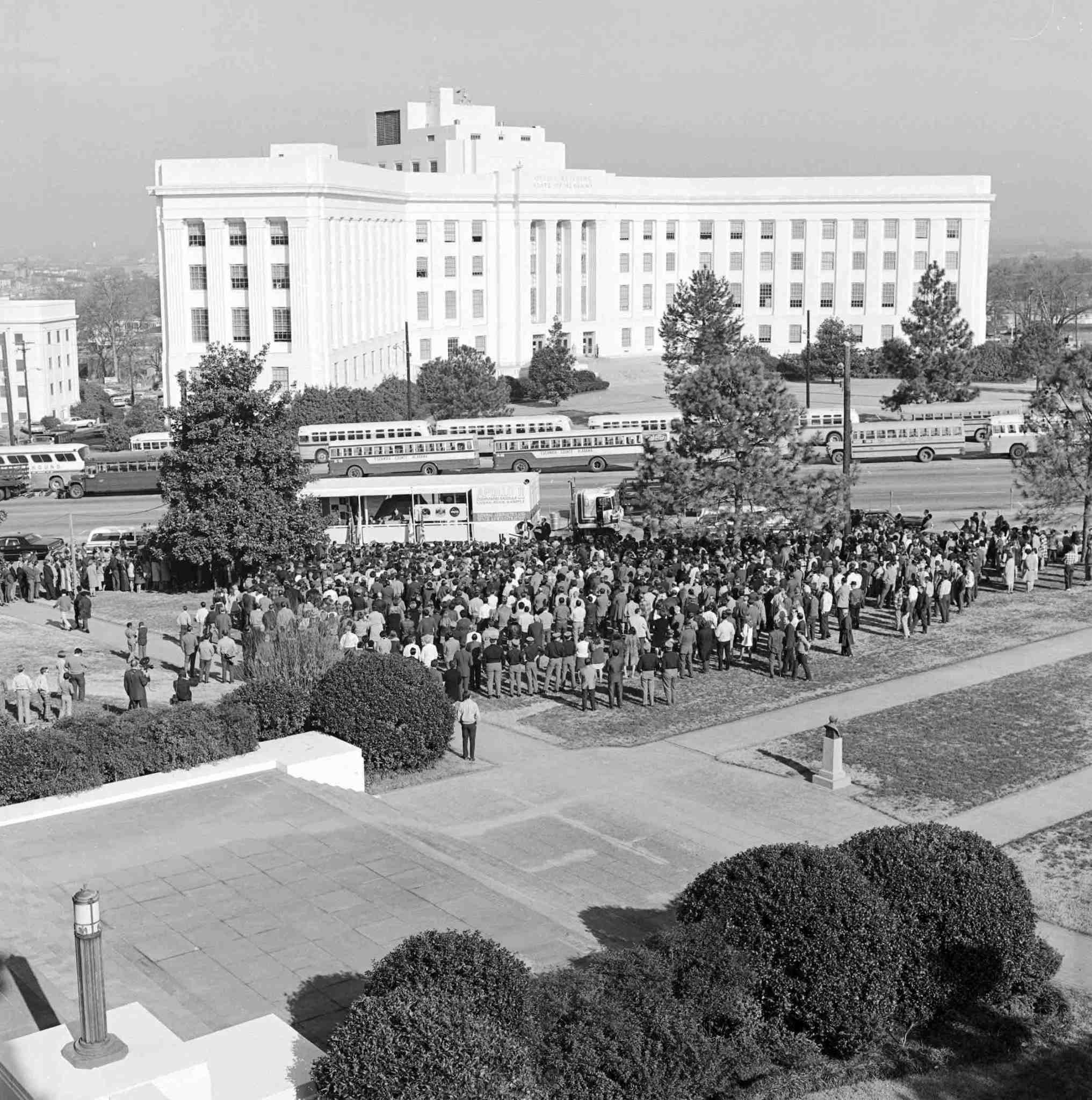 A crowd of visitors gather on the grounds of the Alabama Capitol Building in Montgomery to the see the Apollo 11 command module.