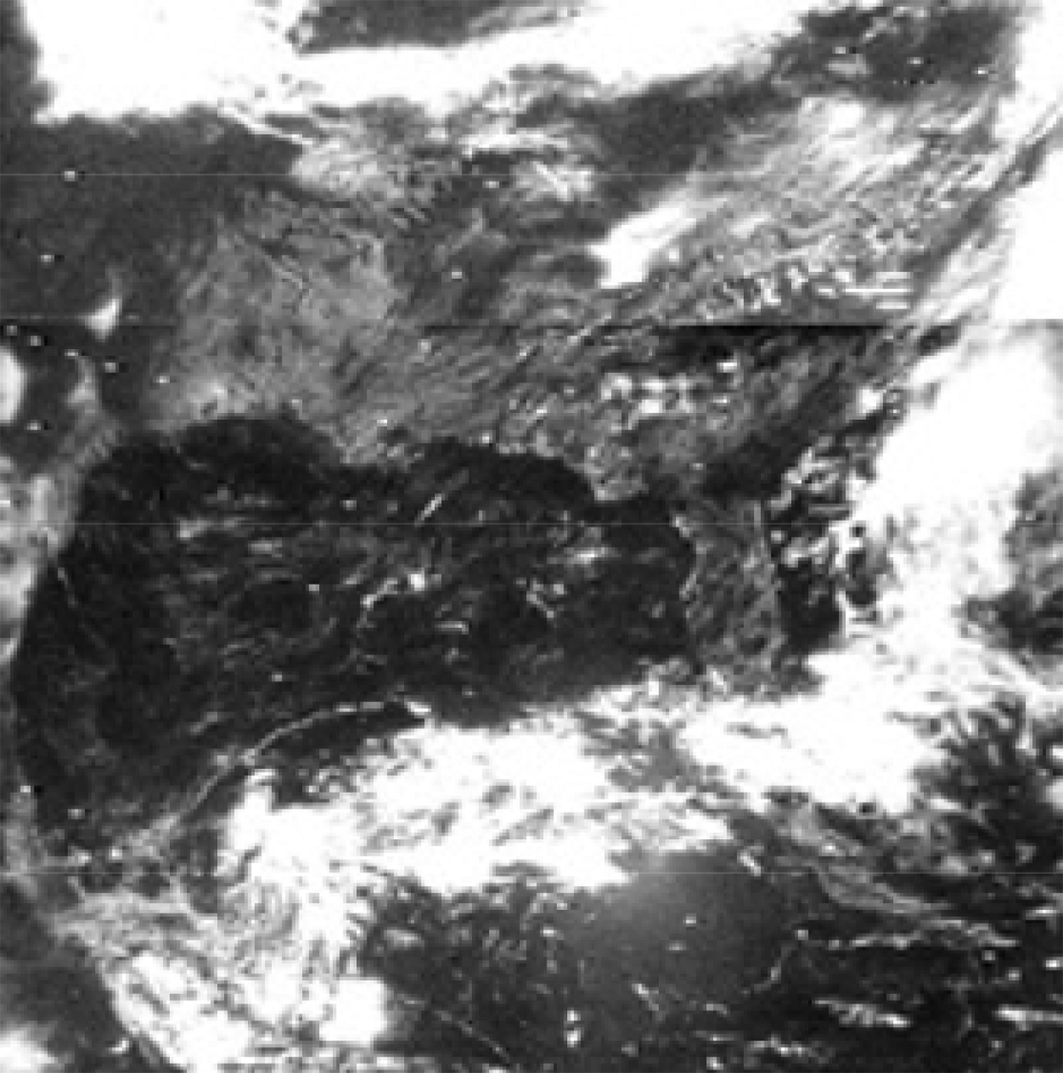 Nimbus-3 image showing clouds over the southeastern U.S. The image is very old looking, grainy, and in black and white. 