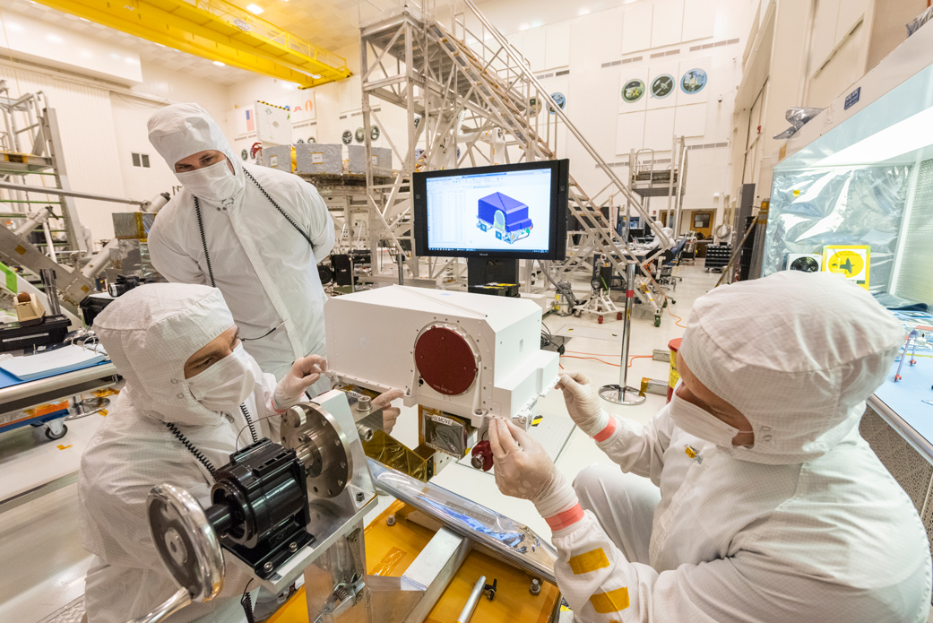 People working on the rover