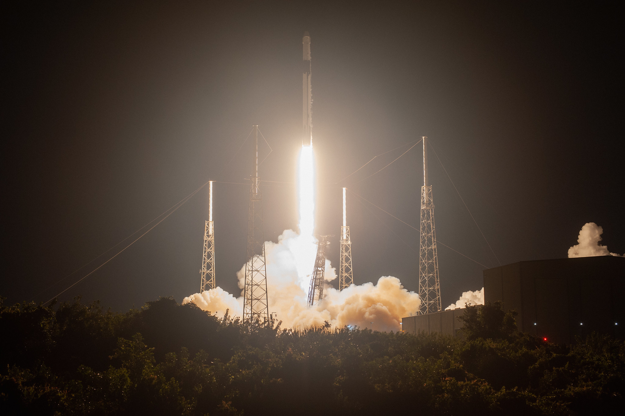 A SpaceX Falcon 9 rocket with the Dragon cargo module lifts off Space Launch Complex 40 on Cape Canaveral Air Force Station