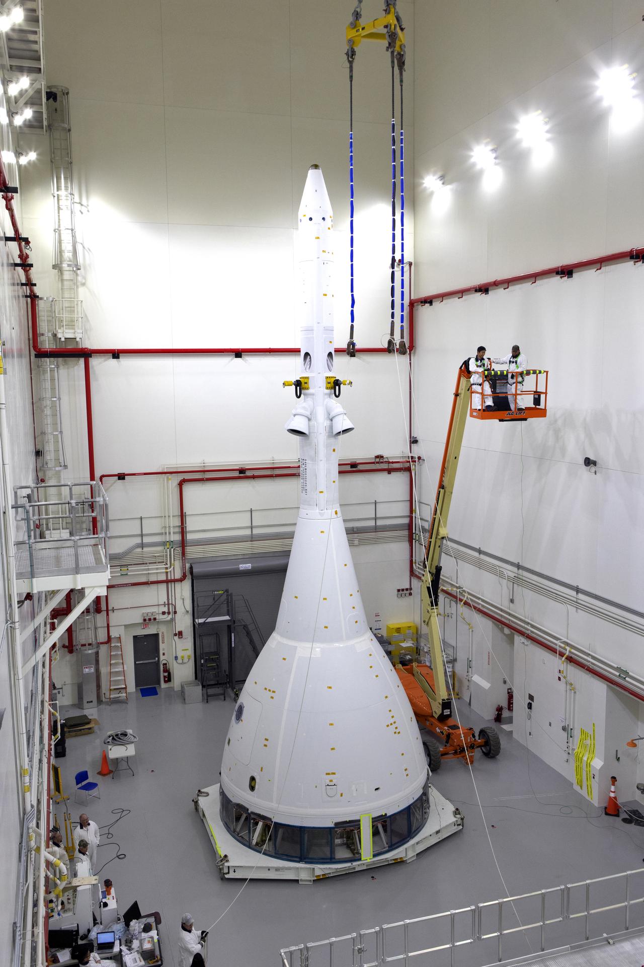 Workers complete the integration of the test version of Orion with the Launch Abort System for AA-2 inside the LASF on May 18.