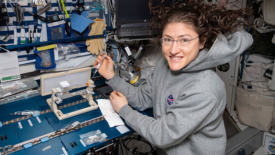 NASA astronaut Christina Koch works on the Capillary Structures experiment