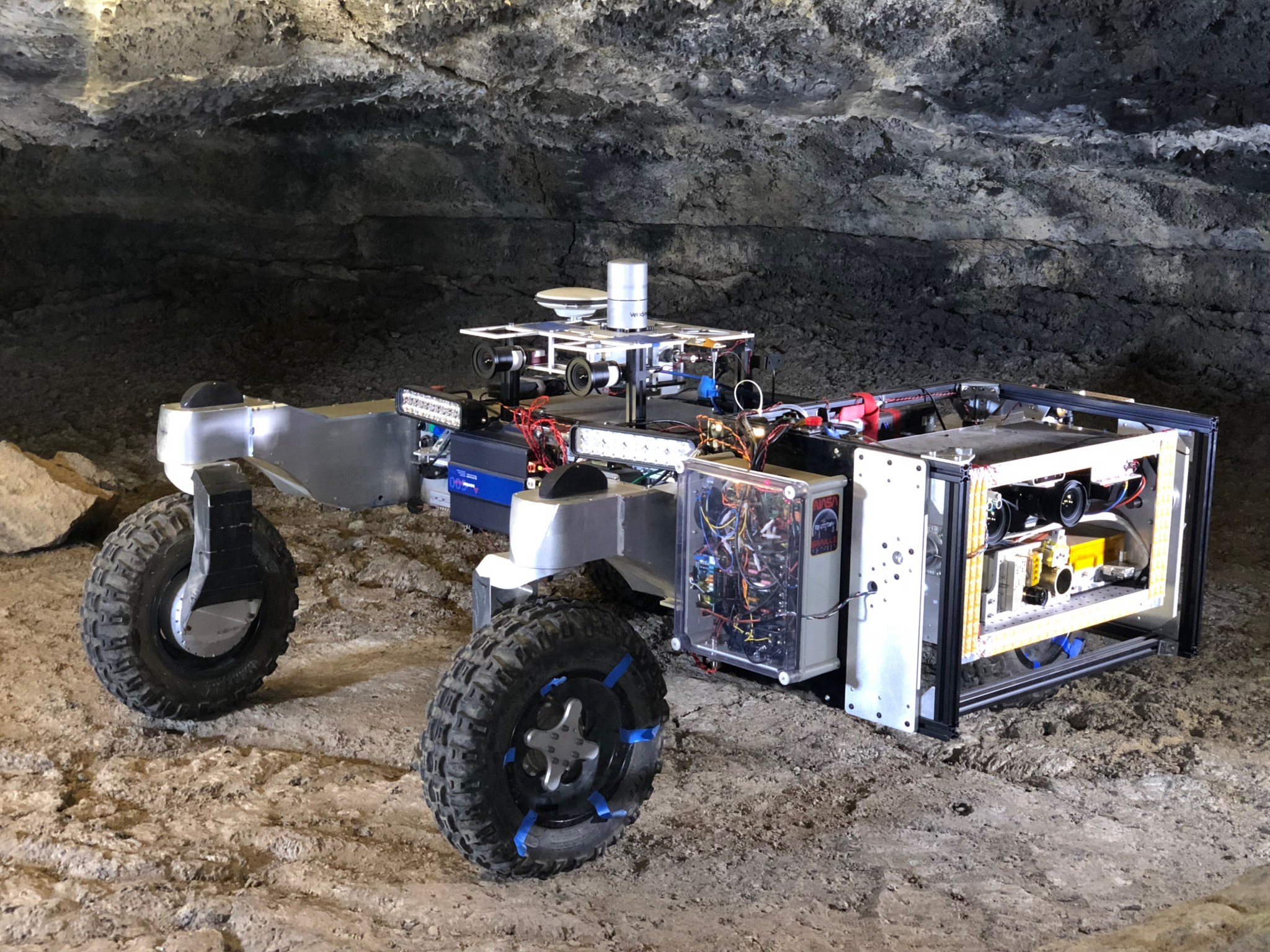 A rover posing in a cave.