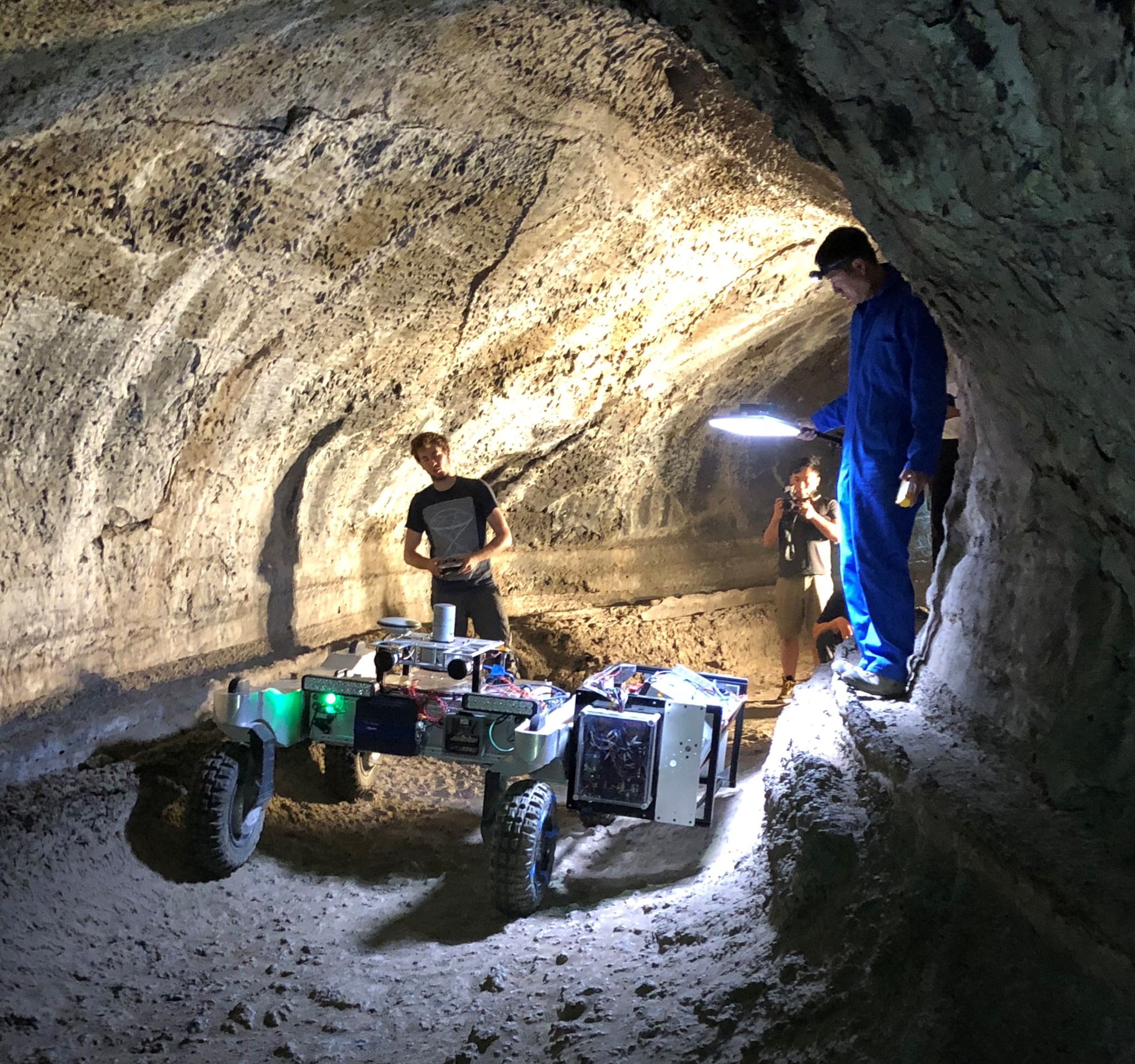 Rover in a cave with two engineers.