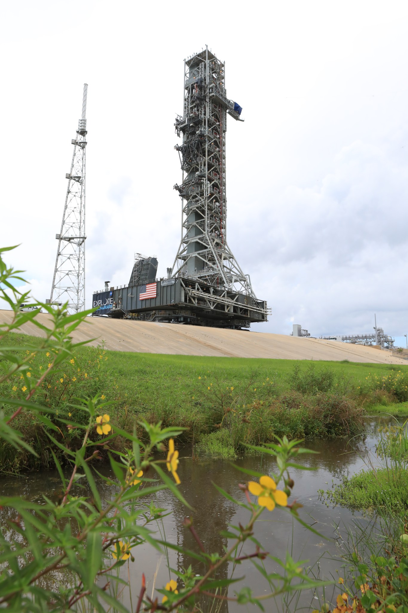 Exploration Ground Systems' mobile launcher photographed at Kennedy Space Center's Launch Complex 39B at the pad surface.